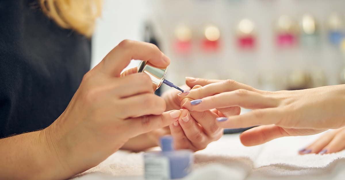 nail-artist-working-with-client-1200x628q4 Female Nail technicians in training session